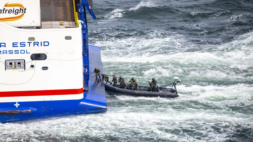 Army Ranger Wing assault team boarding the stern of the vessel)